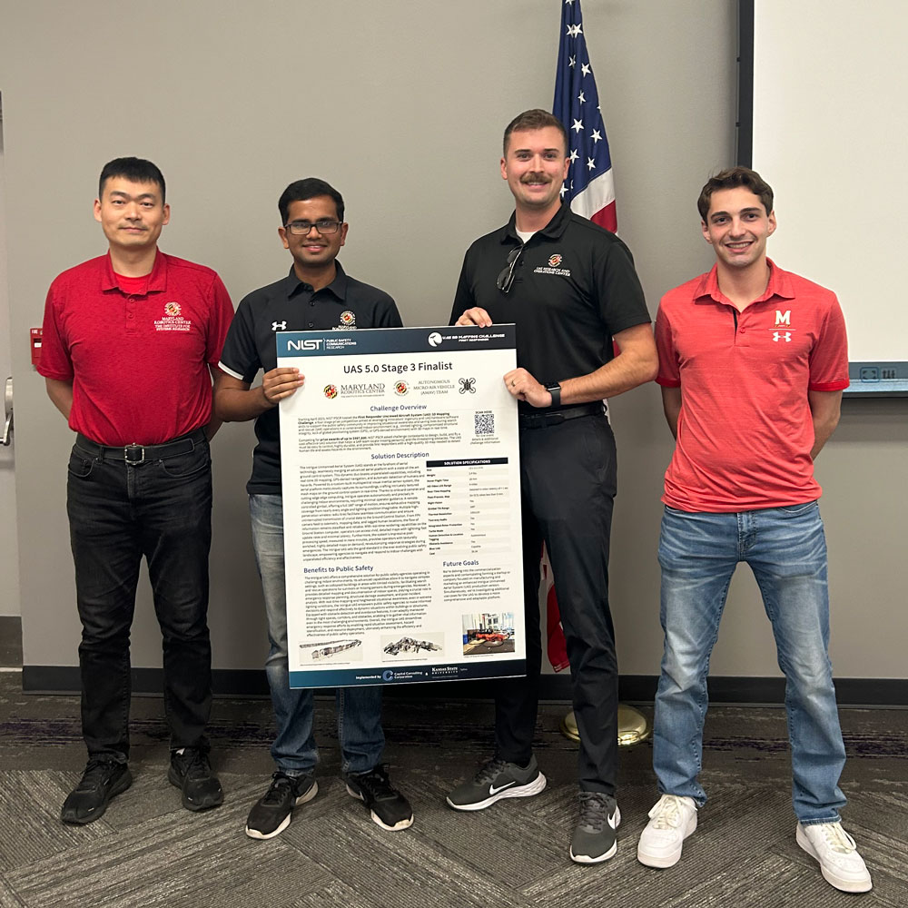 AMAV team representatives at competition in Kansas: aerospace engineering Ph.D. students Wei Cui and Animesh Shastry (Team Lead), UROC Engineer Grant Williams, and computer science/math undergraduate student Alec Luterman.
