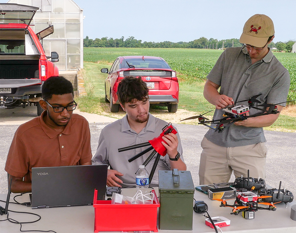 rom left: UROC summer interns Christian Jordan, Ian Wright and Ben Falco test their Counter UAS system at a site in Southern Maryland. [Photo: Lauren Bacon]