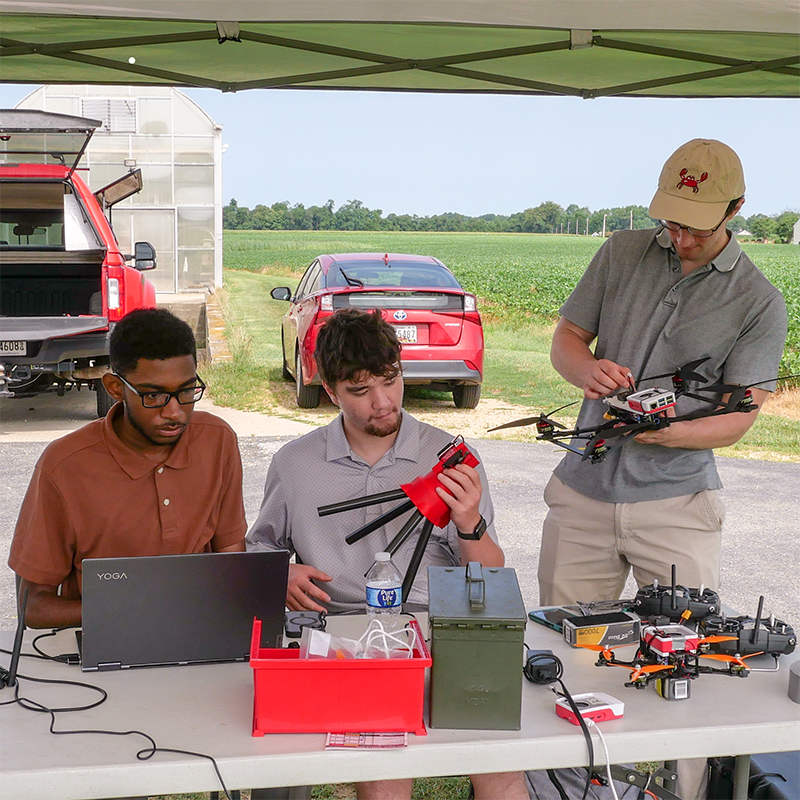 rom left: UROC summer interns Christian Jordan, Ian Wright and Ben Falco test their Counter UAS system at a site in Southern Maryland. [Photo: Lauren Bacon]