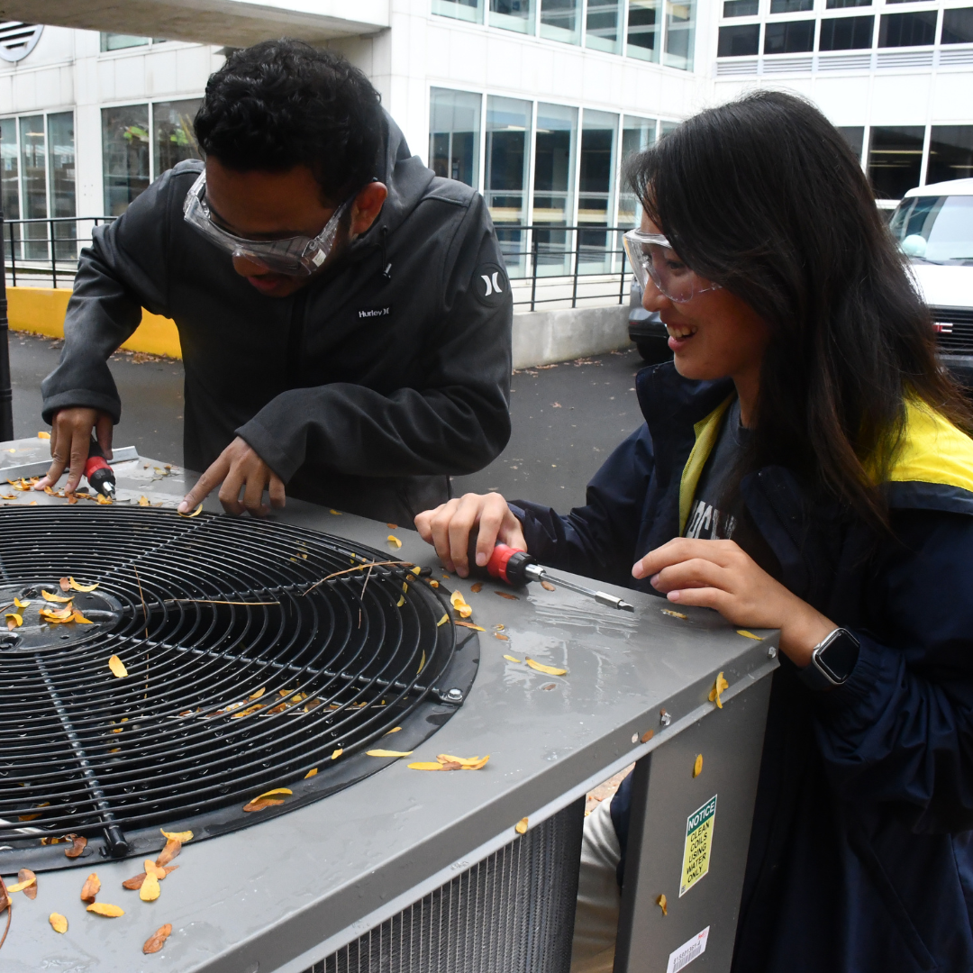 CEEE students with rooftop cold-climate heat pump