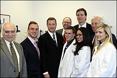 Pictured: (top row, left to right: Herbert Rabin, acting dean, A. James Clark School of Engineering; Scott Laughlin, former director of Mtech's VentureAccelerator Program; Governor Martin O'Malley; Zymetis President and CEO Steve Hutcheson; Steve Davey, Chief Operating Officer of Zymetis; C. Daniel Mote, Jr., University of Maryland President. Bottom row, in lab coats (all recent UM alumni) Dan Forrest; Elizabeth Santos; Kristen Goff.