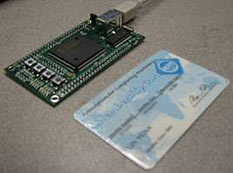 SecureGo prototype device next to credit card.