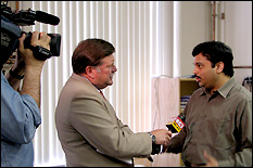 Professor Srinivasa Raghavan (right) explains why Remedium's product is an improvement over others currently on the market to a WJZ reporter.