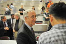 Gordon England '61 chats with students after the lecture (photo by Al Santos).