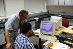 Dr. Anisimov and Adnan in the DLS Lab