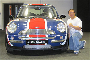 Quynh Nguyen (Ph.D. '03, chemical engineering) with Austin Powers' fab ride at the MINI Cooper manufacturing facility in Oxford, England.