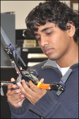 Scholars STS student examines an autonomous rotorcraft, at the STS program's visit to Army Research Laboratory, Adelphi, Nov. 3, 2010.