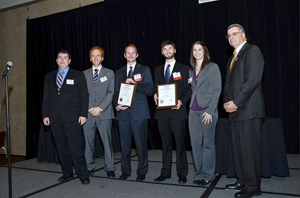 Members of the Gamera team accept the Igor I. Sikorsky International Trophy.