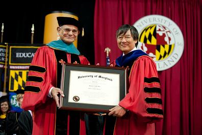 Edward St. John with UMD President Wallace Loh at the campus commencement ceremony.