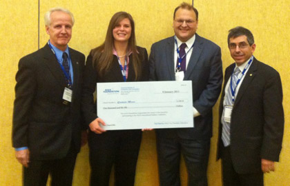 From Left to Right: Ferdinand Grosveld, Director of AIAA Region 1; Ms. Erica Hocking, MS'12, holding a $1000 check for wining the Master's Divison; Prof. Norman M. Wereley, Department Chair; and Prof. Mark Lewis, Past AIAA President and  Director of the Science and Technology Policy Institute at the Institute for Defense Analysis. 
