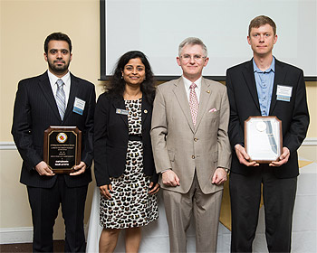 Prof. Donald DeVoe (right) and Omid Rahmanian (left) were honored at the UMD Invention of the Year Awards, and accepted his award from Vice President for Research Dr. Patrick O'Shea (center) and Office of Technology Commercialization Executive Director Dr. Gayatri Varma (center-left).