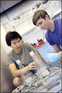 ChBE graduate students and Birich Technologies co-founders Kevin Diehn(right) and Chanda Arya (left) use genetically modified yeast to produce an siRNA binding protein.