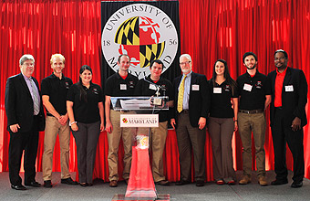 Mark Miller of Sikorsky (4th from right) and J. Michael McQuade of UTC (far left) joined Clark School Dean Darryll Pines (far right) in congratulating the Gamera team members.