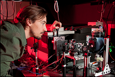 Asst. Prof. Jeremy Munday works with a setup that measures the optical properties of solar cells (how they absorb and reflect light).