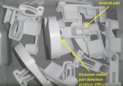 From the RoboSAM video: When RoboSAM can't find a part buried in a bin, it contacts the 