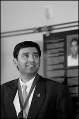 Dr. Rajiv Laroia, in front of his panel in the Innovation Hall of Fame.
